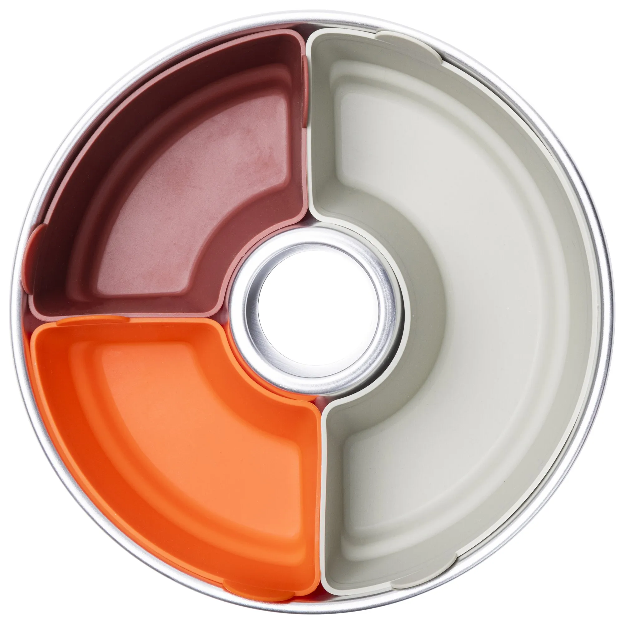 Runde Metallbackform mit sechs farbigen Silikonformen in Rot, Orange und Weiß, von oben betrachtet