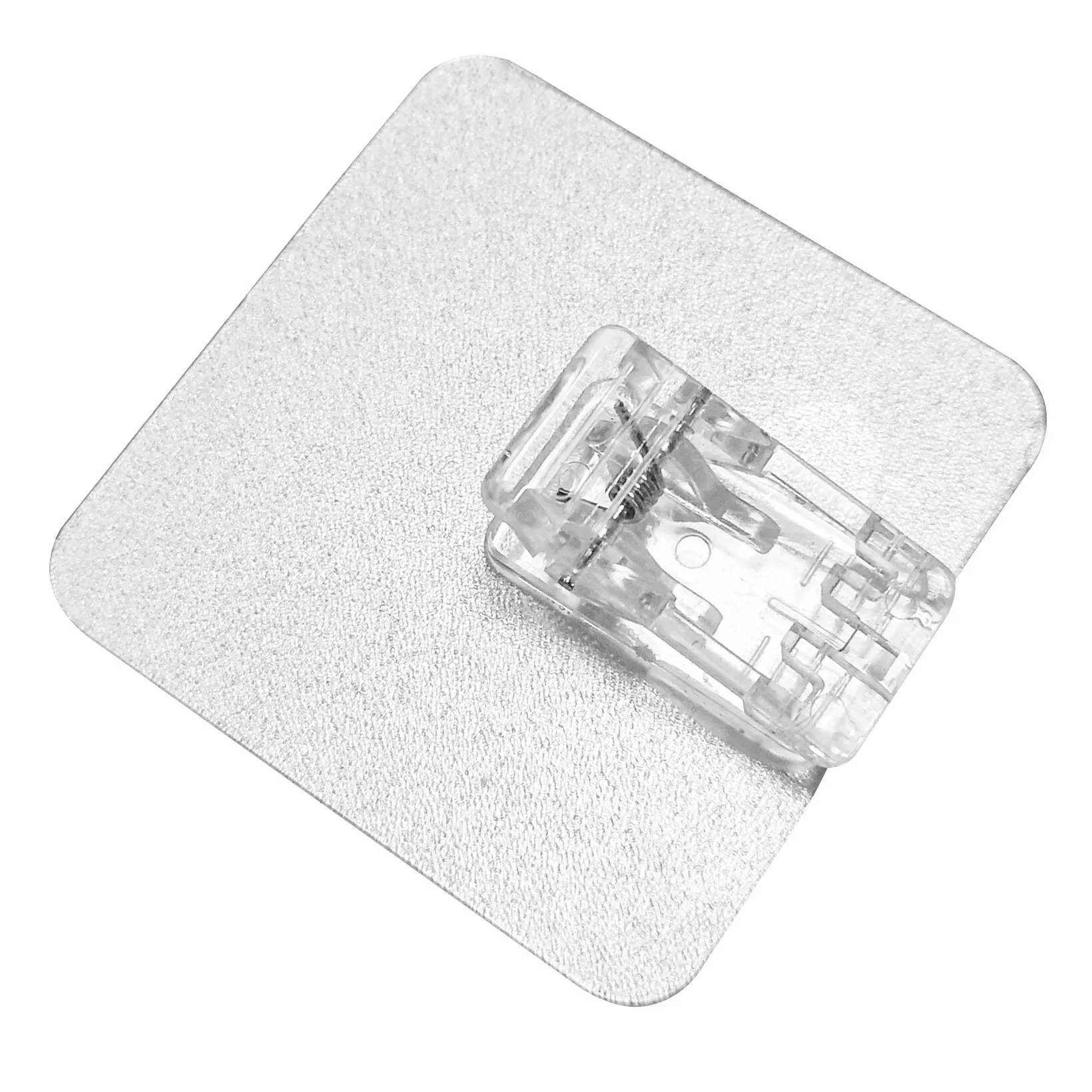 Transparenter Magische Haken Clip Mini auf quadratischer, selbstklebender Trägerplatte mit sichtbarer Metallfedermechanik