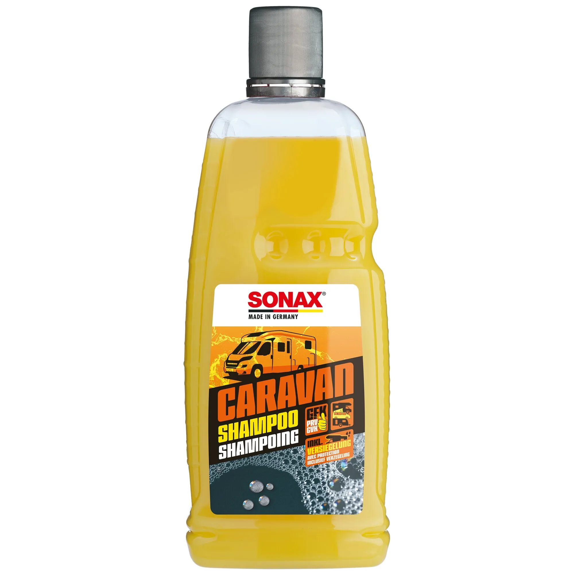 Transparente Flasche mit gelbem CARAVAN Shampoo von SONAX, schwarzem Schraubverschluss und Etikett mit Wohnmobilmotiv
