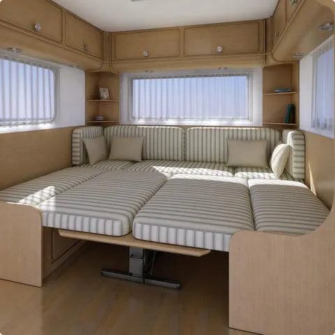 Braunes Hubtischgestell HTA 116, 75 cm, sichtbar unter einer gepolsterten Sitz- und Liegefläche im Wohnmobil