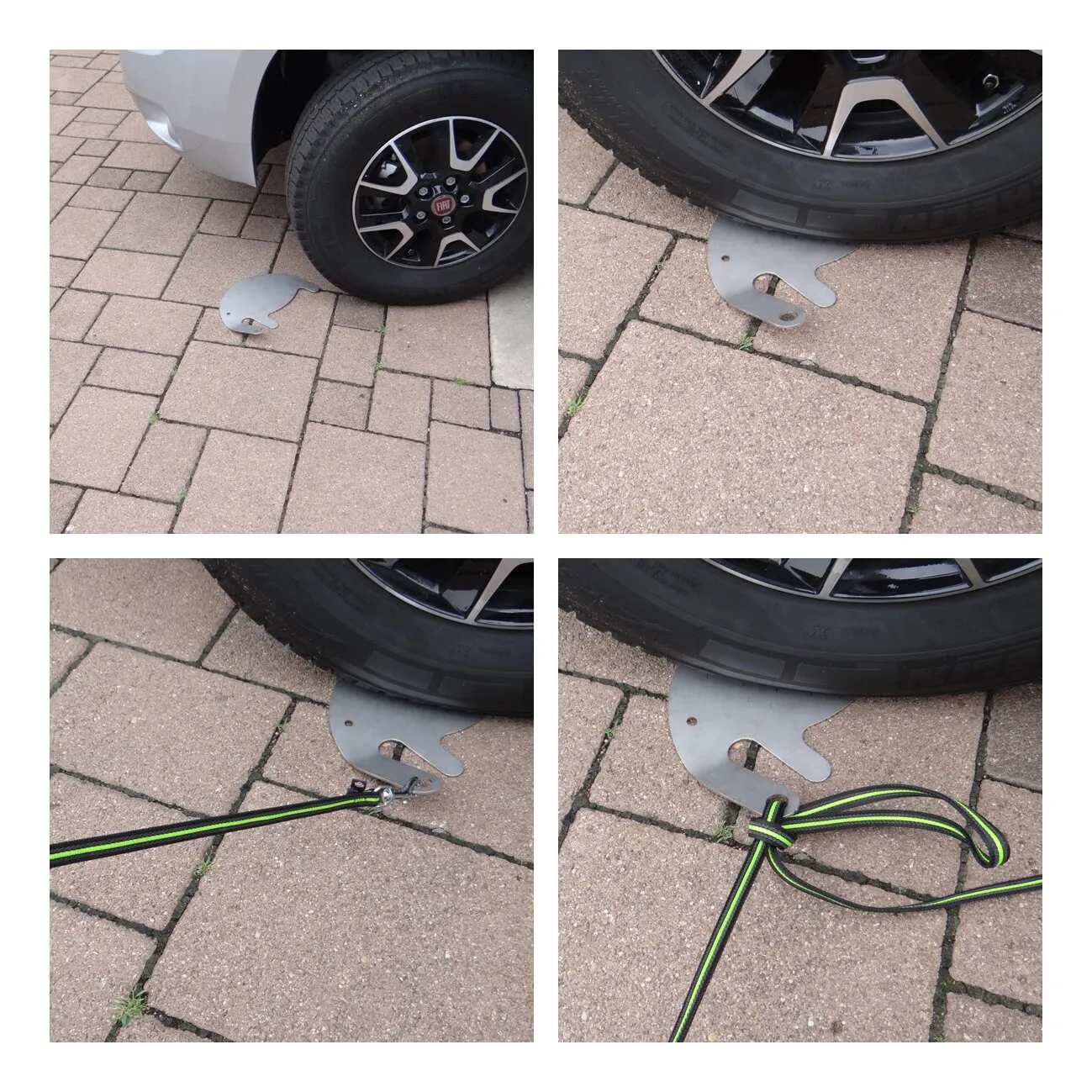 Grauer Metall-Hundesitter in Elefantenform unter einem Autoreifen mit eingehängter und geschlungener Hundeleine