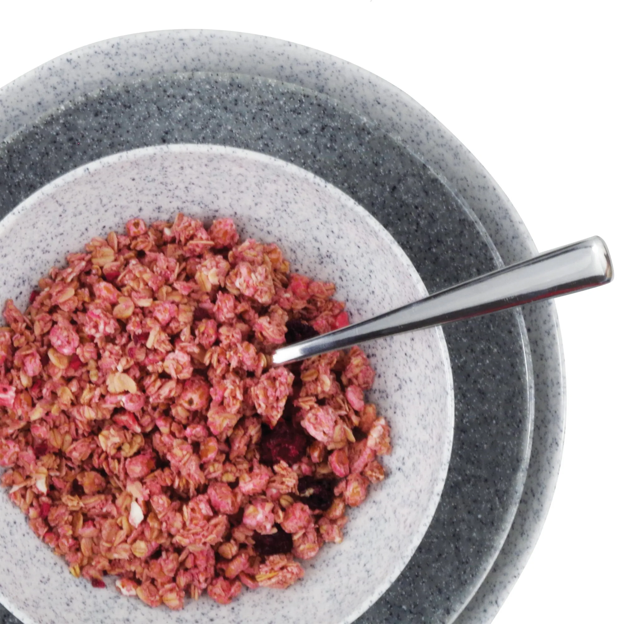 Granitgraues, gesprenkeltes Geschirrset Solid Line mit Teller und Schale, gefüllt mit pinkfarbenem Müsli und Metalllöffel